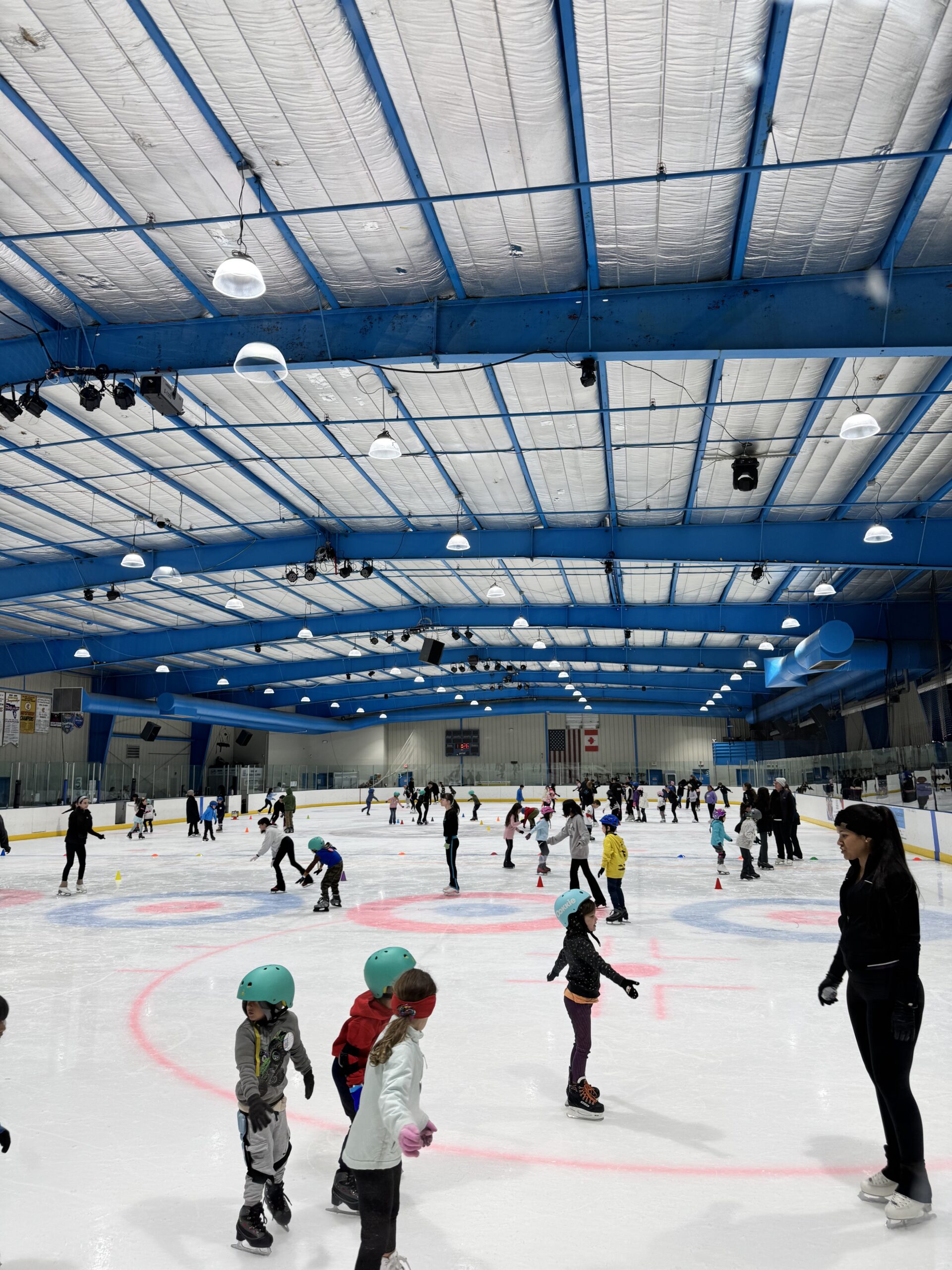 Children and Adults enjoying skating lessons during the Ice Factory's Skating School