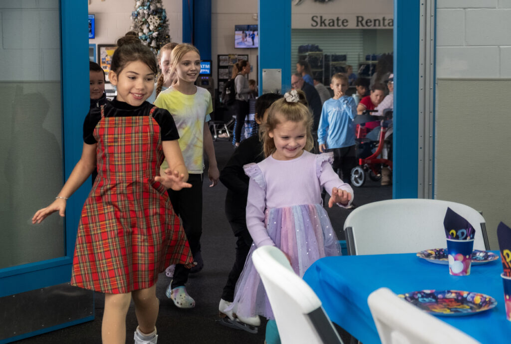 children running into a fun party room for a birthday party experience at the ice factory.