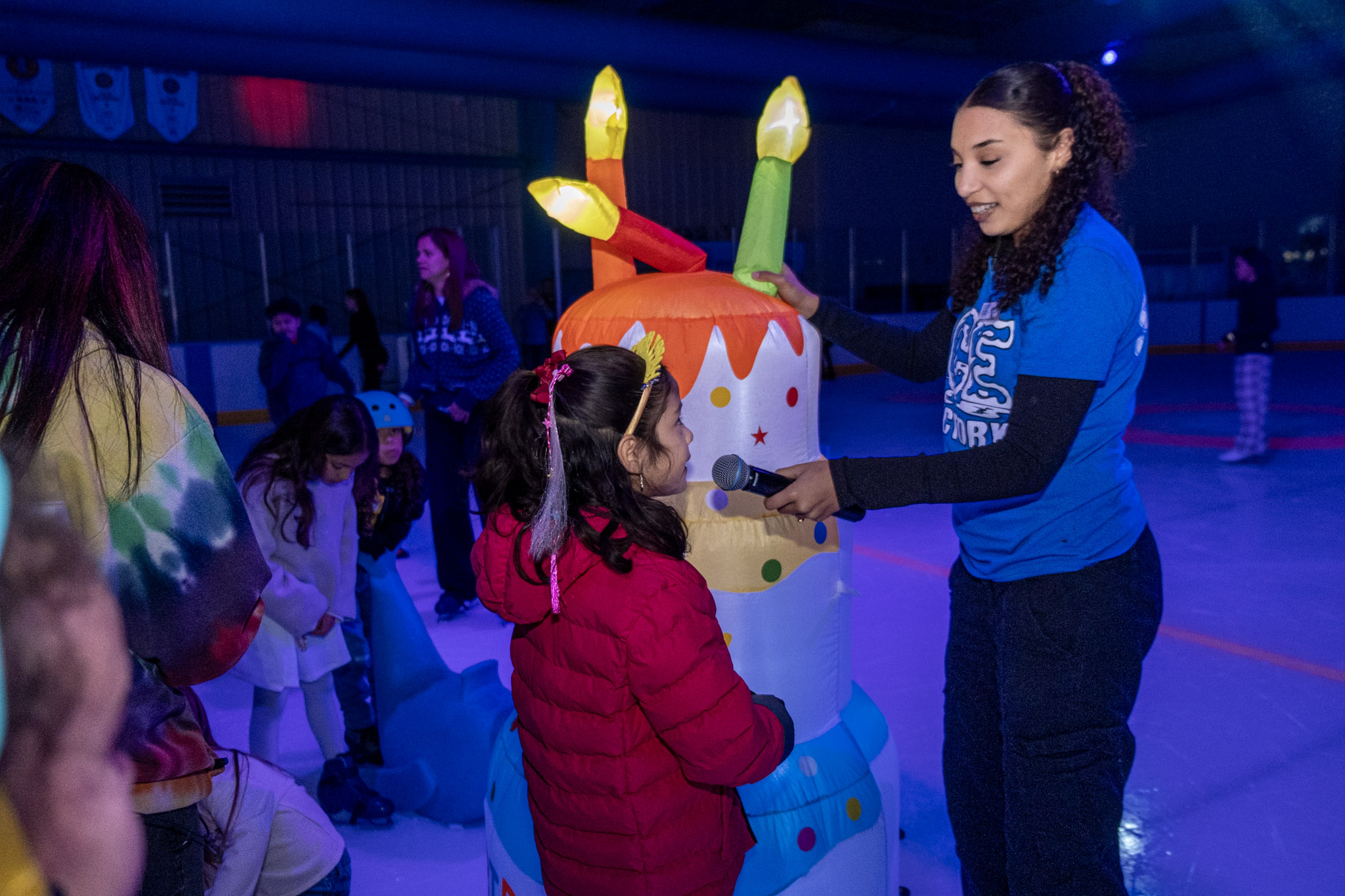 Birthday party interacting with the fun DJ playing games on the ice at the Ice Factory