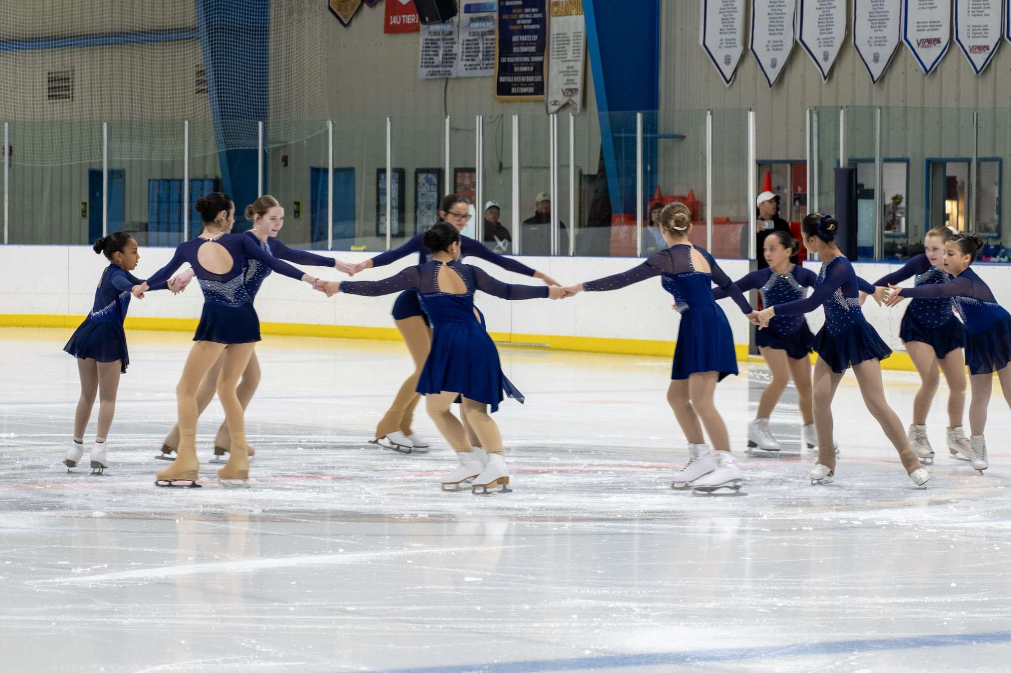 Group of figure skaters skating a routine for a ice show at the Ice Factory